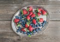 Fresh strawberry and blueberry mix on a metal dish (tray) over a Royalty Free Stock Photo