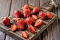 Fresh strawberry on a chopping wooden board