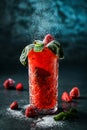 Fresh strawberry cocktail with basil, berries and powdered sugar in jar glass on dark blue background. Studio shot of drink in Royalty Free Stock Photo