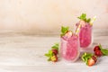 Fresh strawberry cocktail. Fresh summer cocktail with strawberry and ice cubes. Glass of strawberry soda drink Royalty Free Stock Photo