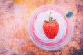 Fresh strawberry on coconut jelly with butterfly