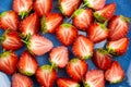 Fresh strawberry cut in half on blue plate background Royalty Free Stock Photo