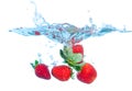 Fresh Strawberry Dropped into Water with Splash Royalty Free Stock Photo