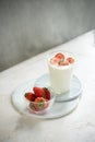 Fresh strawberry on a glass with dessert yogurt and strawberry  on white background Royalty Free Stock Photo