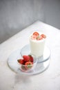 Fresh strawberry on a glass with dessert yogurt and strawberry  on white background Royalty Free Stock Photo