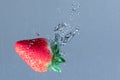 Fresh Strawberry Plunge into Water Royalty Free Stock Photo