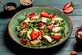 Fresh strawberry salad with arugula, chicken, avocado and strawberries. Plate with a keto diet food. Top view Royalty Free Stock Photo