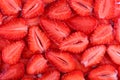 Fresh strawberry slice red background. Summer background texture of sliced strawberries. Royalty Free Stock Photo