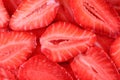 Fresh strawberry slice red background. Summer background texture of sliced strawberries. Royalty Free Stock Photo