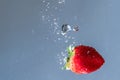 Fresh Strawberry Plunge into Water Royalty Free Stock Photo