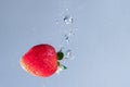 Fresh Strawberry Plunge into Water Royalty Free Stock Photo