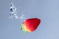 Fresh Strawberry Plunge into Water Royalty Free Stock Photo