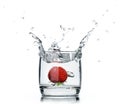 A fresh strawberry splashing water in a glass on white Royalty Free Stock Photo
