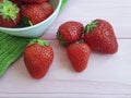 Fresh strawberry organic on a pink wooden background summer harvest Royalty Free Stock Photo