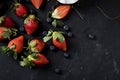 Fresh strawberry, top view on a black background.