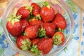 Fresh strawberry in a transparent salad bowl