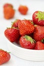 Fresh strawberry on white background in white bowl, fresh fruits for breakfast or healthy food snack Royalty Free Stock Photo