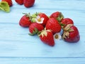 Fresh organic strawberry healthy fruit farming summer harvest on a blue wooden background