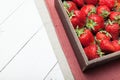 Fresh strawberry in wooden box, rustic background. Copy space for text Royalty Free Stock Photo