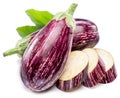 Fresh striped aubergines or eggplants with leaf and slices isolated on white background