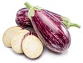 Fresh striped aubergines or eggplants with leaf and slices isolated on white background