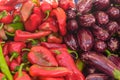 fresh striped purple eggplants and red peppers at the local market 1 Royalty Free Stock Photo