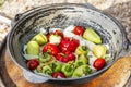 Fresh stuffed peppers in a cauldron on the street. Traditional autumn dish of Russian cuisine. Picnic in nature. Close-up Royalty Free Stock Photo