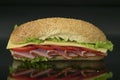 fresh submarine sandwich with ham, cheese, tomatoes, lettuce Royalty Free Stock Photo