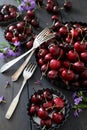 Fresh summer cherries and flowers in plates Royalty Free Stock Photo