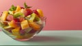 Fresh Summer Fruit Salad in Glass Bowl on Dual-Tone Background Royalty Free Stock Photo