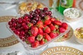 Fresh summer fruits: cherries, organic strawberries crystal bowl . Strawberries and cherries in a crystal bowl Royalty Free Stock Photo