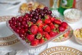 Fresh summer fruits: cherries, organic strawberries crystal bowl . Strawberries and cherries in a crystal bowl Royalty Free Stock Photo