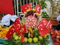 Fresh summer fruits in a watermelon basket decorated with Turkish flags Royalty Free Stock Photo