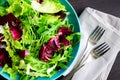 Fresh summer green salad mix on a wooden table Royalty Free Stock Photo