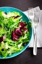 Fresh summer green salad mix on a wooden table Royalty Free Stock Photo