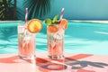 pink cocktail with swimming pool background Royalty Free Stock Photo