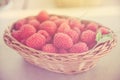 Fresh summer raspberry in a basket. Selective focus. Royalty Free Stock Photo