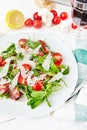 Fresh, summer salad with halves of cherry tomatoes and arugula Royalty Free Stock Photo