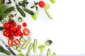 Fresh summer vegetables on a bright sunny table with place for text, tomatoes, cucumbers and parsley for cooking salad, detox diet Royalty Free Stock Photo