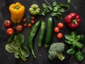 Fresh summer vegetables flatlay on green background. Tomatoes, pepper, parsley, broccoli, basil, squash, zucchini Royalty Free Stock Photo