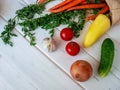 Fresh summer vegetables on a white wooden background. Royalty Free Stock Photo