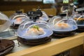 Fresh sushi ready to serve in conveyor belts restaurant