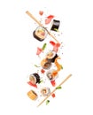 Fresh sushi rolls with various ingredients are falling down