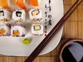 Fresh sushi and sashimi on a plate with chopsticks Royalty Free Stock Photo