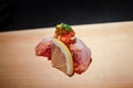 Fresh sushi topped with fish liver Ankimo and ponzu jelly sauce