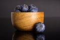 Fresh sweet blueberry isolated on black glass Royalty Free Stock Photo