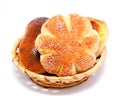 Fresh sweet buns and rolls with poppy and cream in the basket Royalty Free Stock Photo