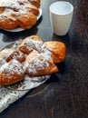 Fresh and sweet cakes with jam and powdered sugar