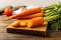 Fresh and sweet carrots on wooden table.