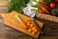 Fresh and sweet carrots on wooden table.